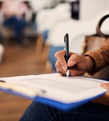 Patient filling out paperwork in lobby