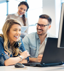 Colleagues smiling together in office