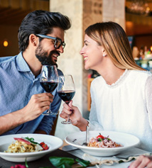 Couple smiling at each other on date in restaurant