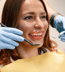 Smiling Invisalign patient at dentist visit