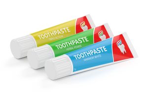 three tubes of toothpaste