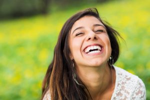 Woman with flawless smile outdoors