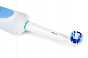 white electric toothbrush blue bristles