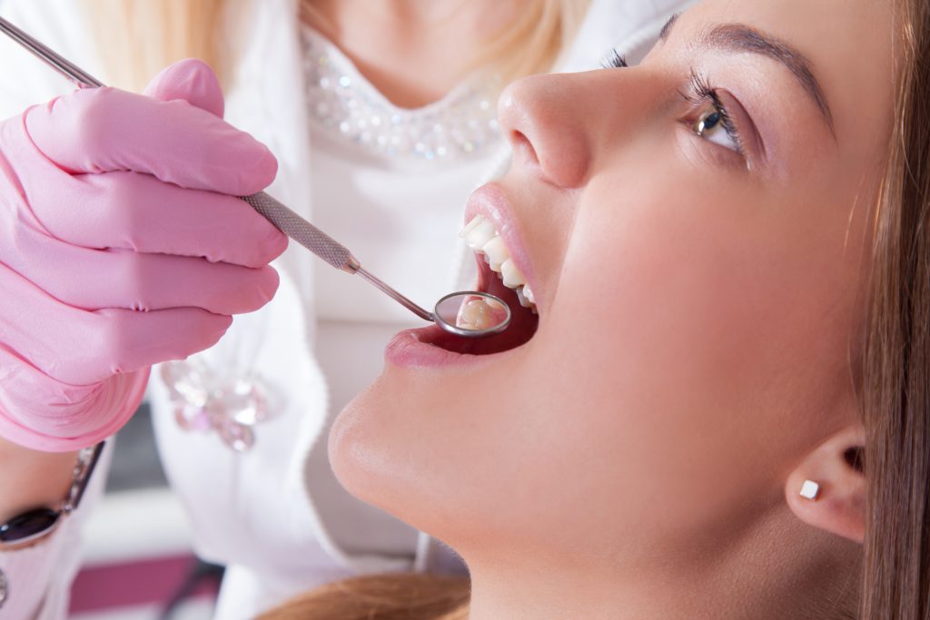 Woman getting a dental exam