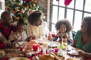 family eating holiday dinner together