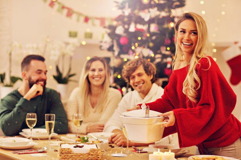 young adults smiling at holiday event