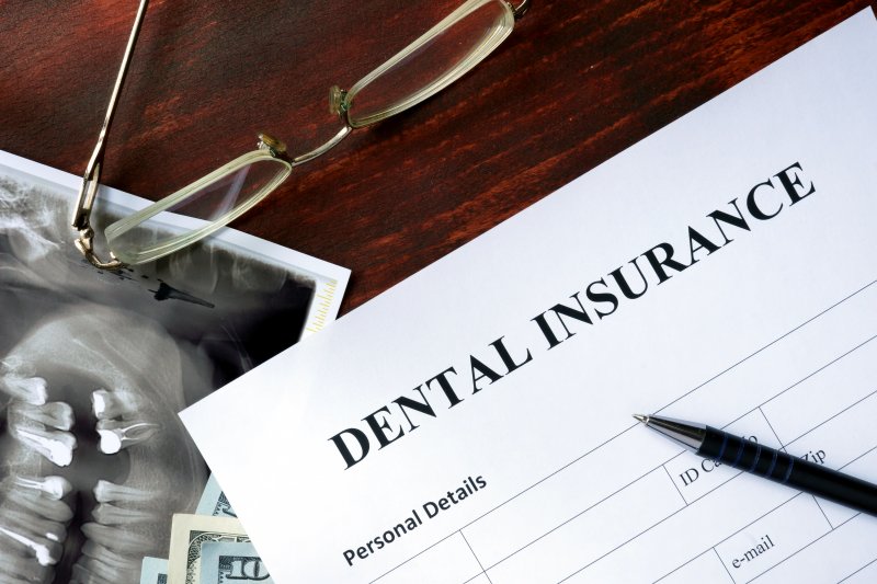 Dental insurance paperwork on table