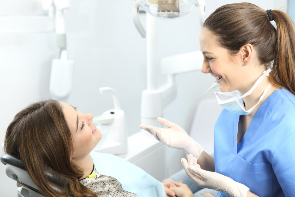 woman learning about parts of the mouth in Columbus