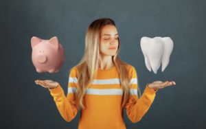 A patient thinking about how dental visits can save her a lot of money