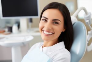Woman smiling in dentist's chair.