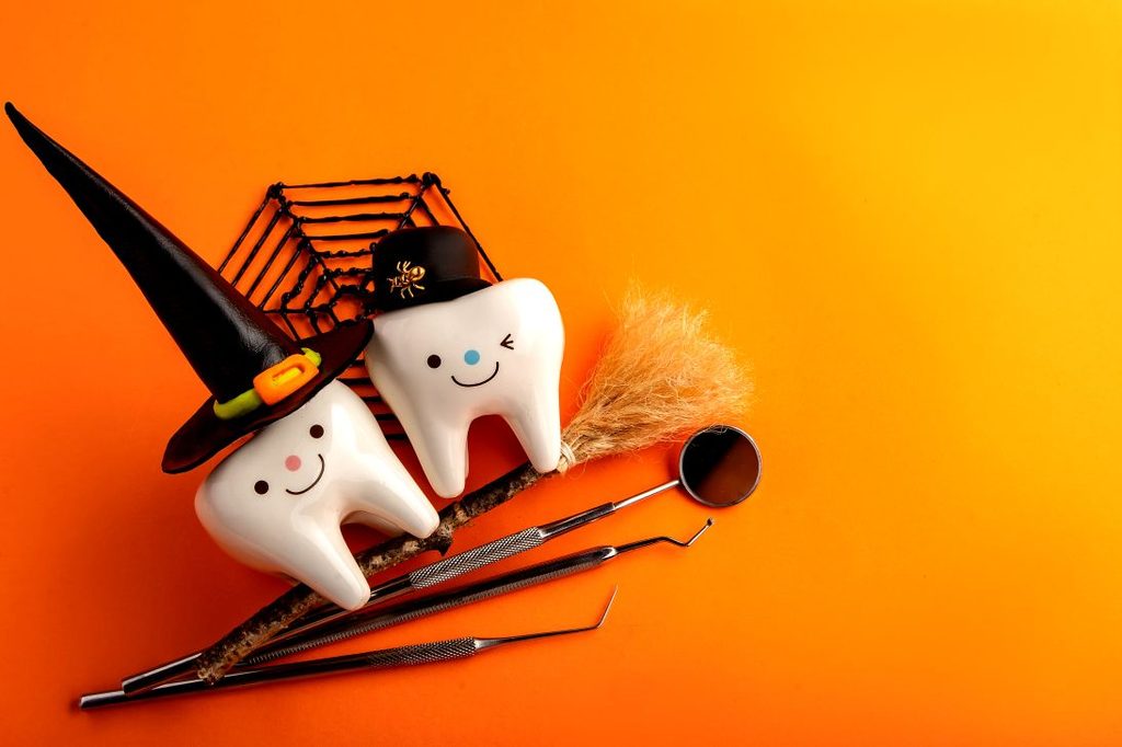 Teeth dressed in Halloween costumes
